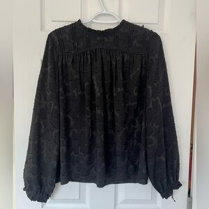 Aritzia Wilfred high collar blouse with burnout floral design.